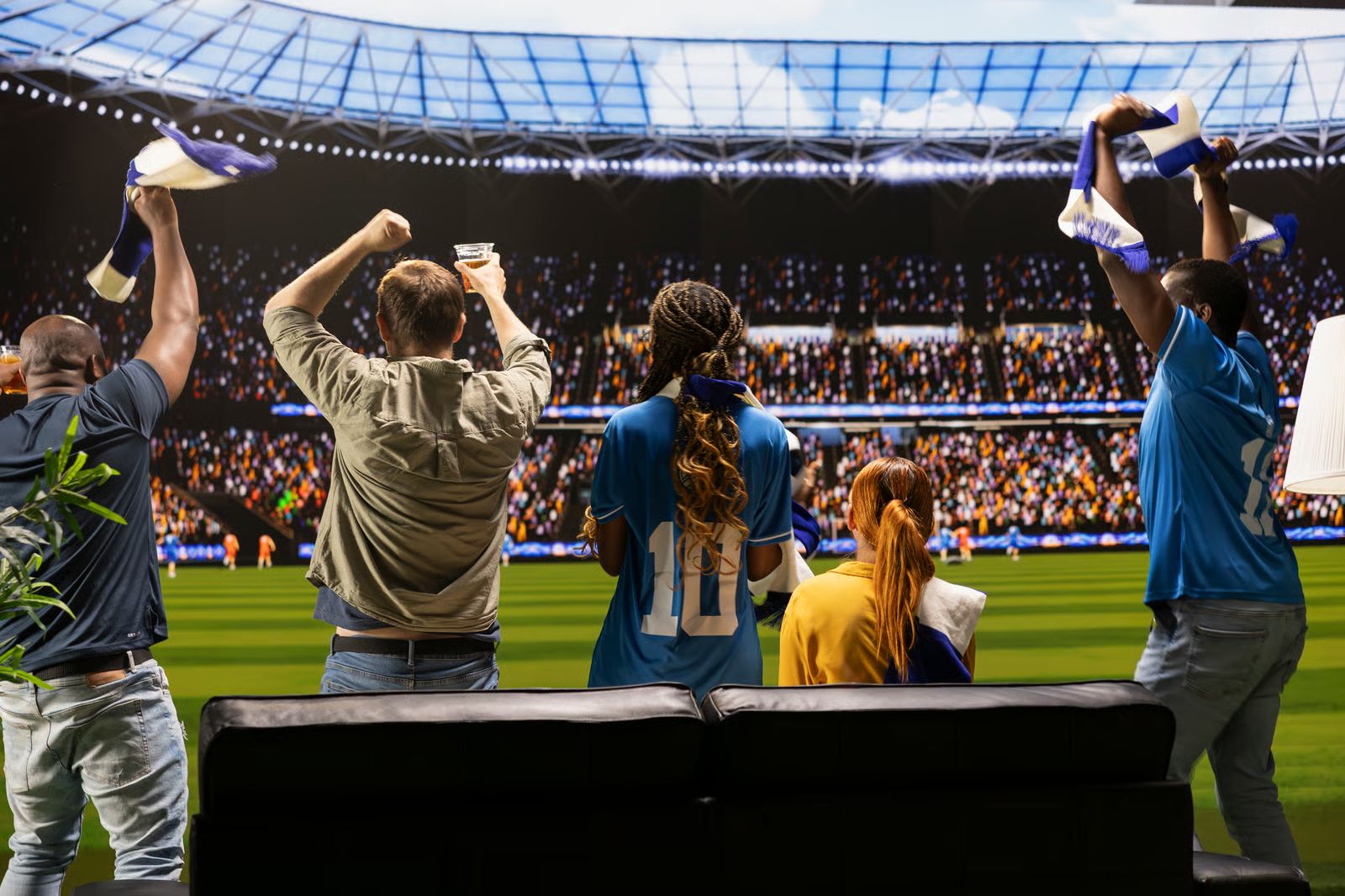 Fans celebrating in a packed stadium